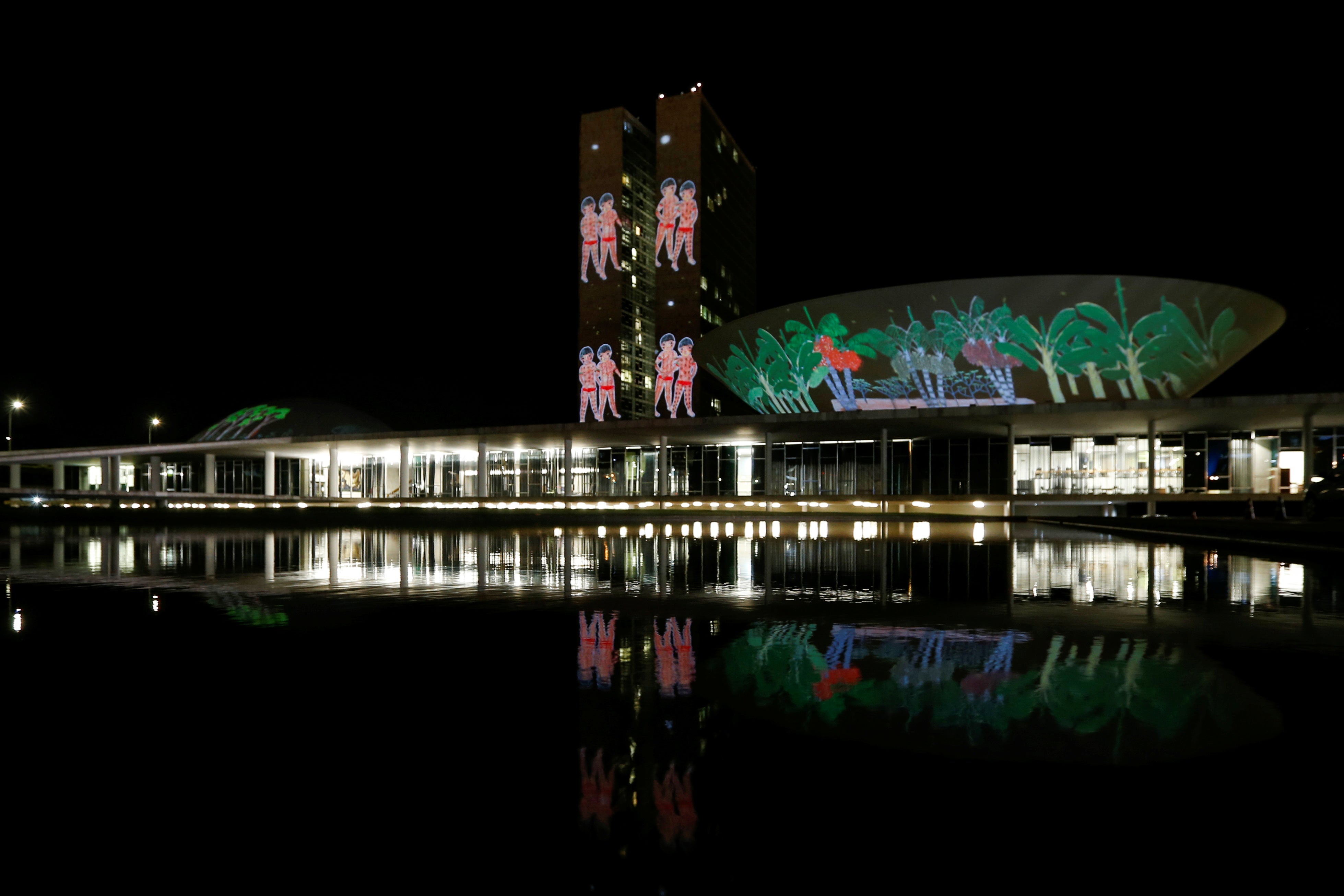 A projection on the building of the National Congress with drawings of the Yanomami xapiri, the spirits of the forest, is seen during a protest to evict illegal gold miners from Brazil’s largest indigenous Yanomami reservation