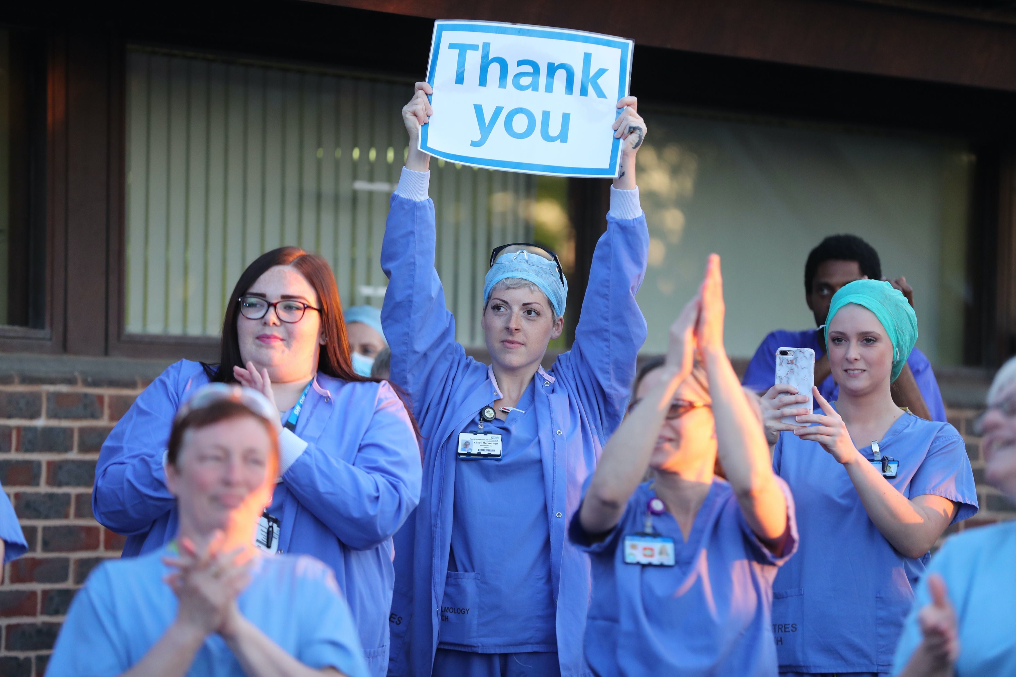 Staff at William Harvey Hospital in Kent join in applause to salute local heroes in April