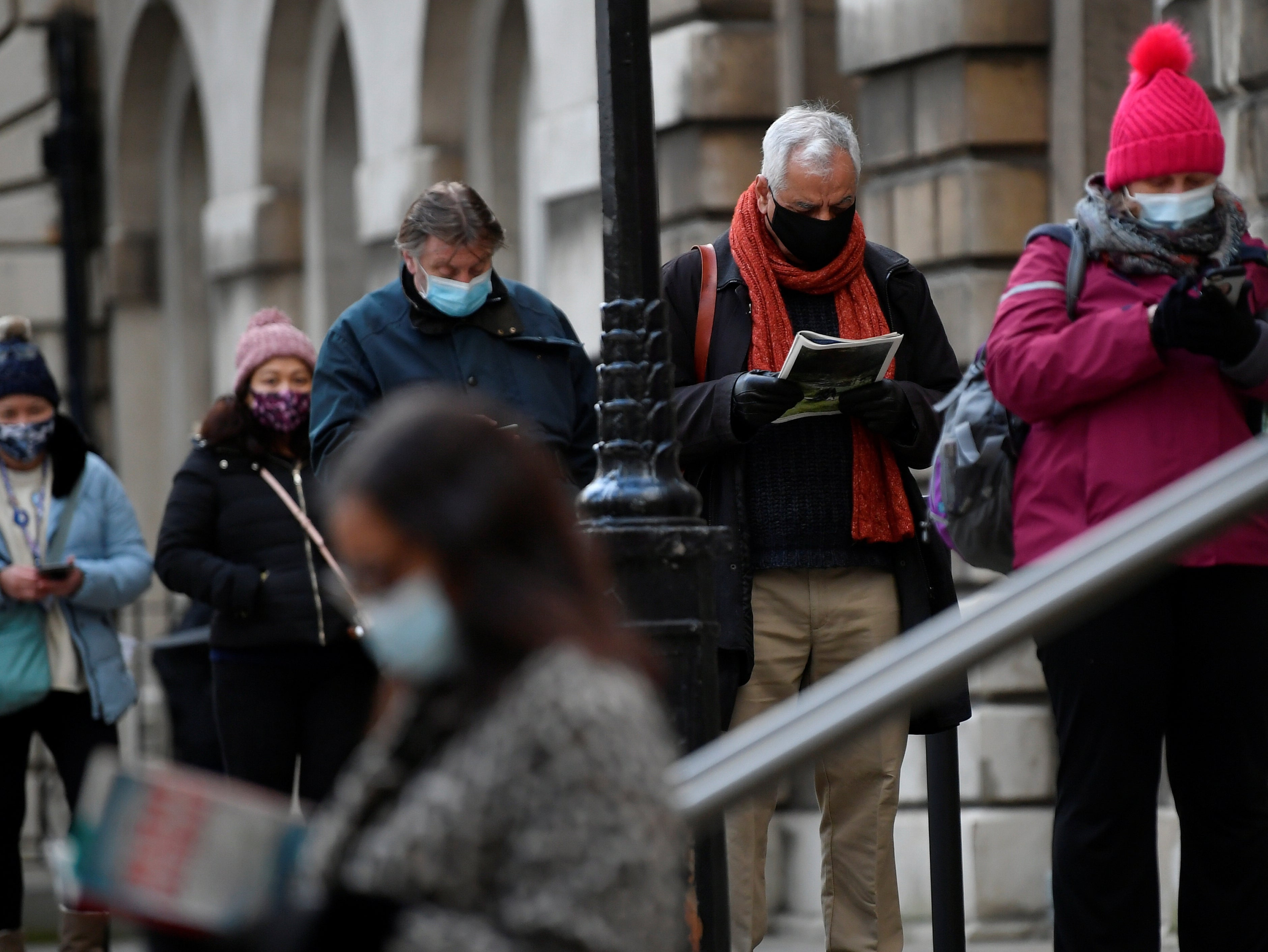 People queued for vaccines in London as Boris Johnson said ministers were trying to roll it out as quickly as possible