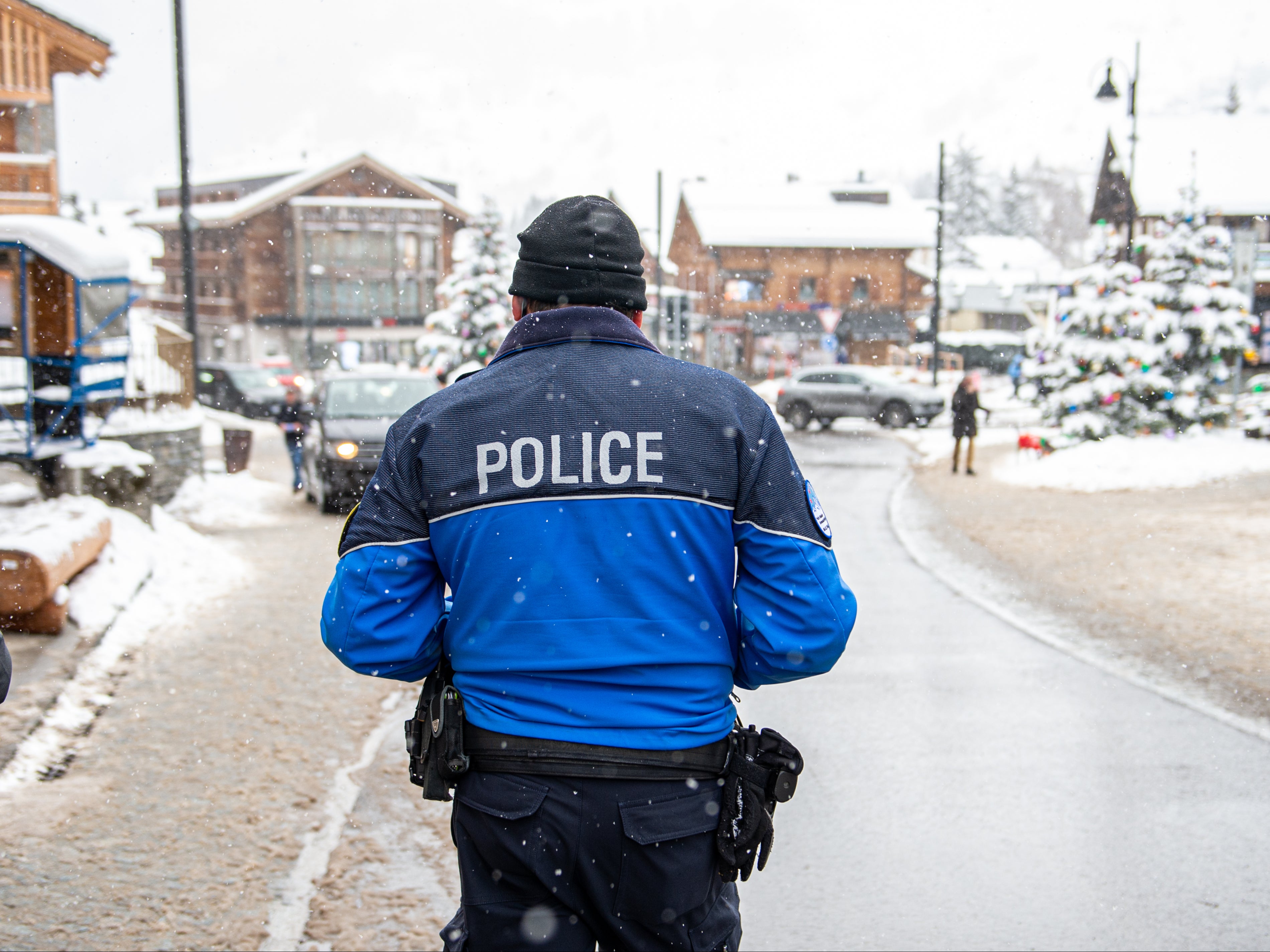 A policeman walks at Verbier centre on 29 December by which time most British tourists are said to have left the resort