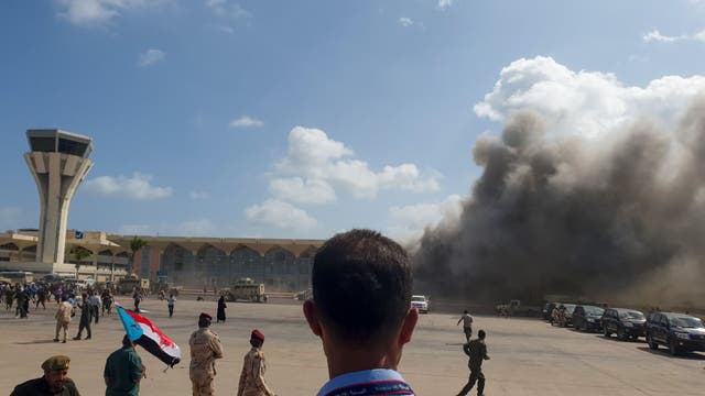 Smoke billows from Aden Airport following the attack which has left at least 25 dead (Photo by Saleh Al-OBEIDI / AFP)