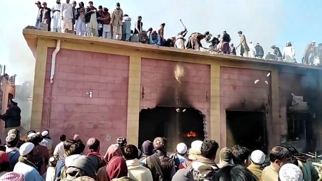 Pakistan arrests 14 after mob led by Islamist clerics sets century-old Hindu temple on fire