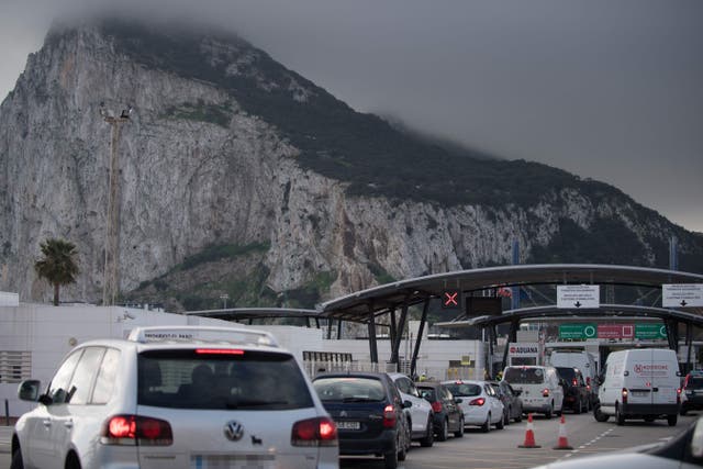 <p>Vehicles queue at the border between Spain and Gibraltar on 22 December</p>