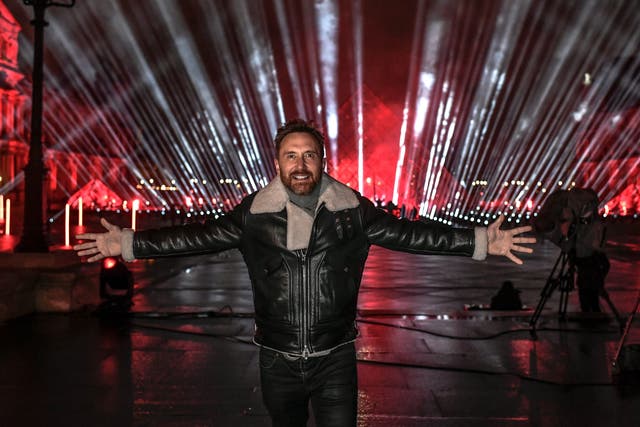 David Guetta poses on the stage set up for his 2021 New Year’s Eve charity concert in front of the Louvre Museum in Paris, France, on 29 December 2020