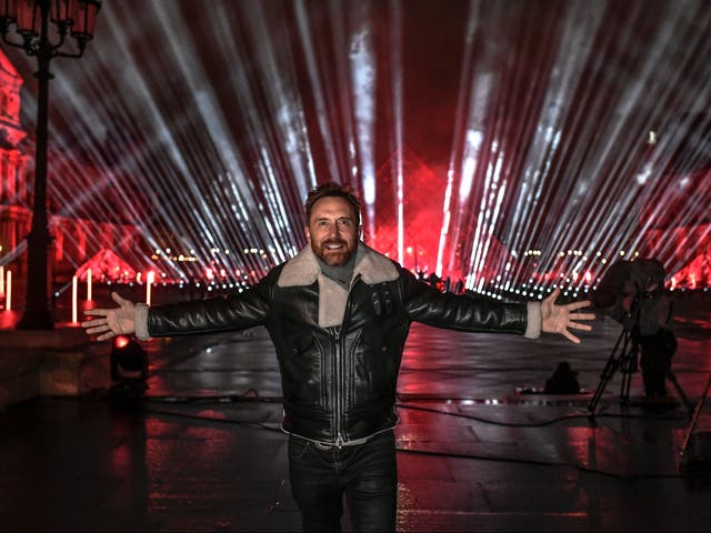David Guetta poses on the stage set up for his 2021 New Year’s Eve charity concert in front of the Louvre Museum in Paris, France, on 29 December 2020