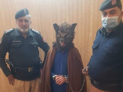 A man in Peshawar dressed as a werewolf to scare people&nbsp;