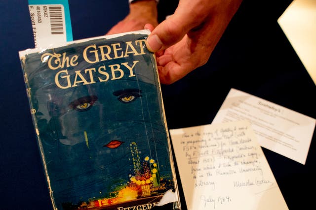 <p>A copy of ‘The Great Gatsby’ is displayed on 6 June 2013 at Sotheby’s in New York. The first edition sold for $112,500</p>