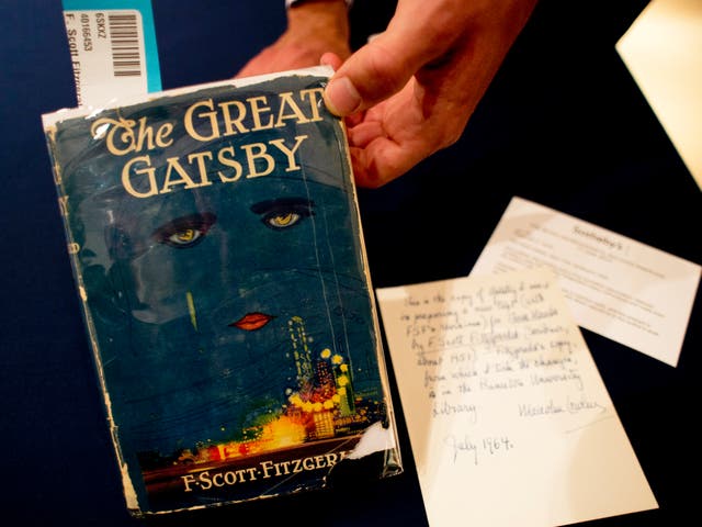 <p>A copy of ‘The Great Gatsby’ is displayed on 6 June 2013 at Sotheby’s in New York. The first edition sold for $112,500</p>