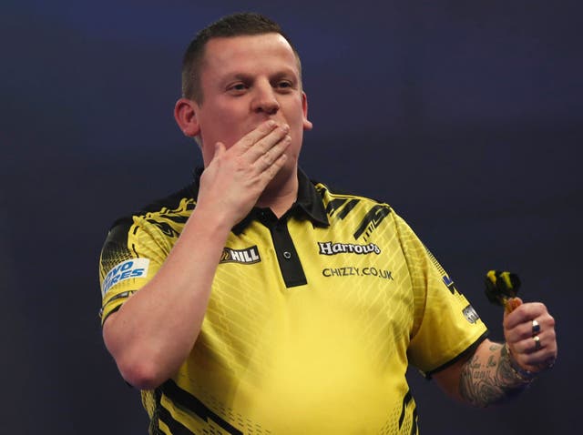 <p>Dave Chisnall celebrates defeating Michael van Gerwen</p>
