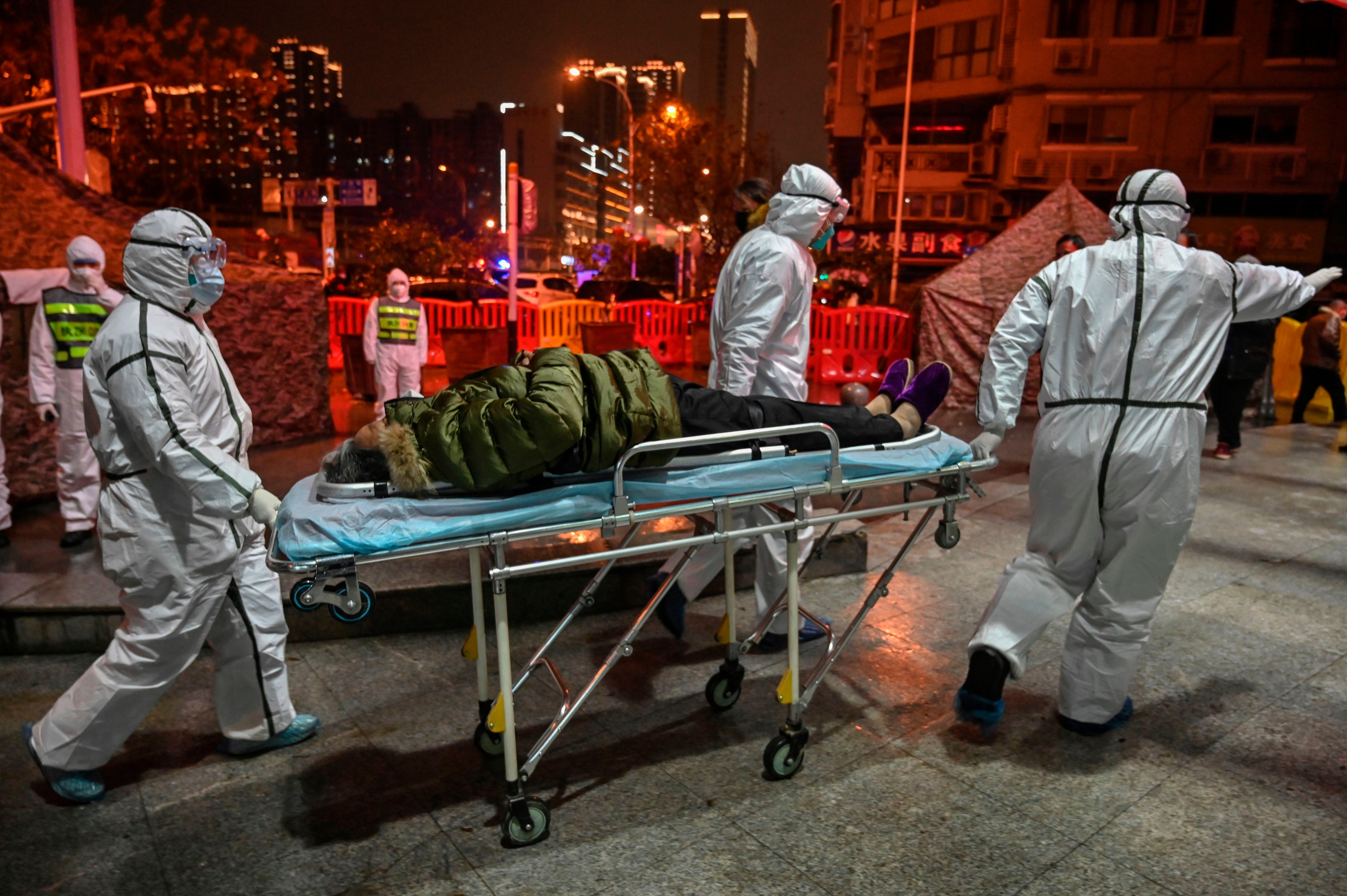 Medical staff move a patient at the Wuhan Red Cross Hospital&nbsp;