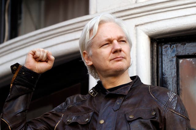 <p>In this 19 May 2017 file photo, WikiLeaks founder Julian Assange greets supporters outside the Ecuadorian embassy in London, where he had been in self-imposed exile since 2012</p>