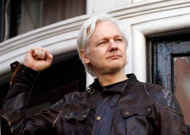 <p>In this 19 May 2017 file photo, WikiLeaks founder Julian Assange greets supporters outside the Ecuadorian embassy in London, where he had been in self-imposed exile since 2012</p>