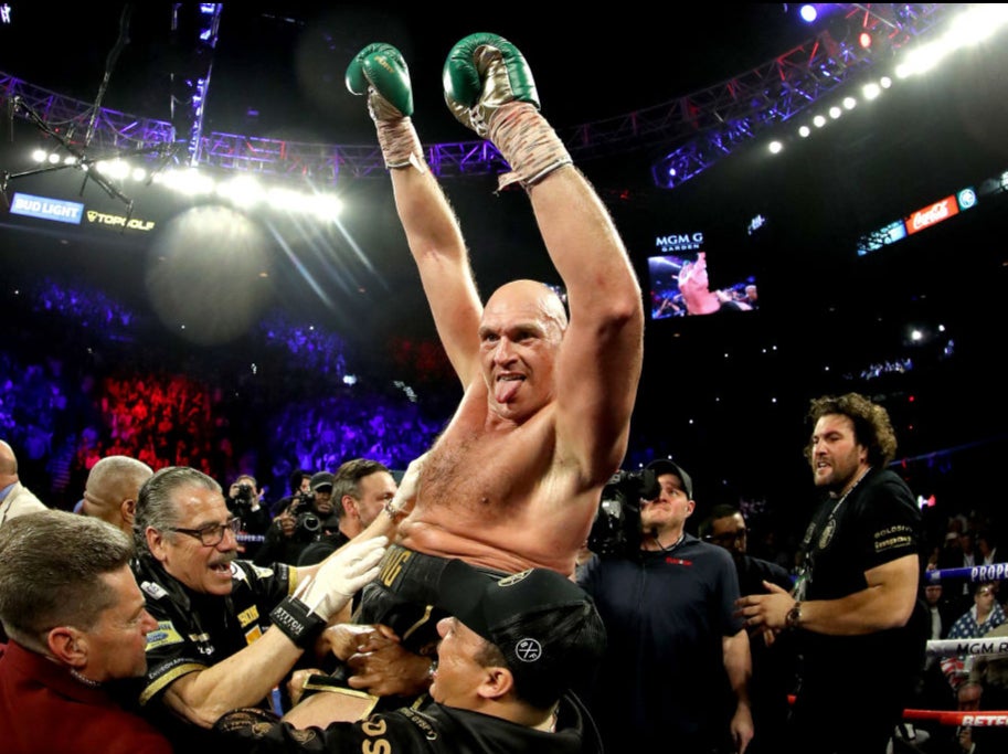 Tyson Fury celebrates after defeating Deontay Wilder