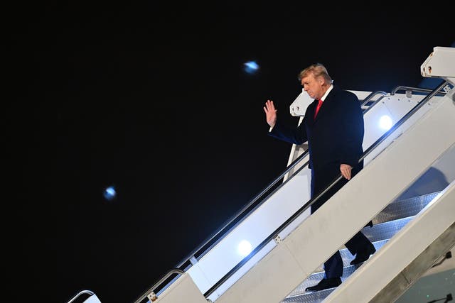 <p>Donald Trump arrives for a campaign rally in Georgia for two GOP Senate candidates on Monday night.</p>