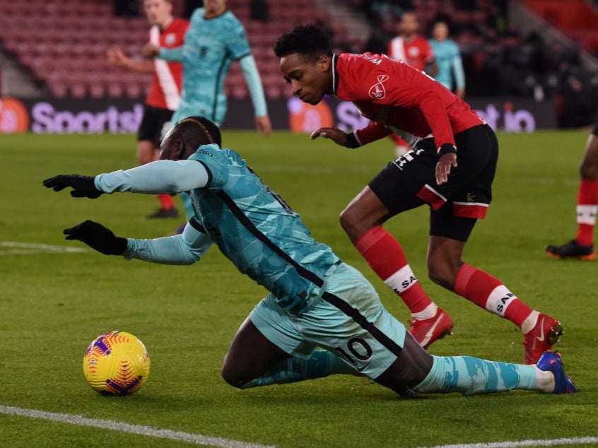 Sadio Mane is challenged by Kyle Walker-Peters