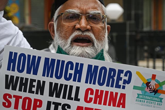 A protester holds a placard during a protest against the Chinese government’s policies on Muslim Uighur minorities, in Mumbai on 10 December, 2020.