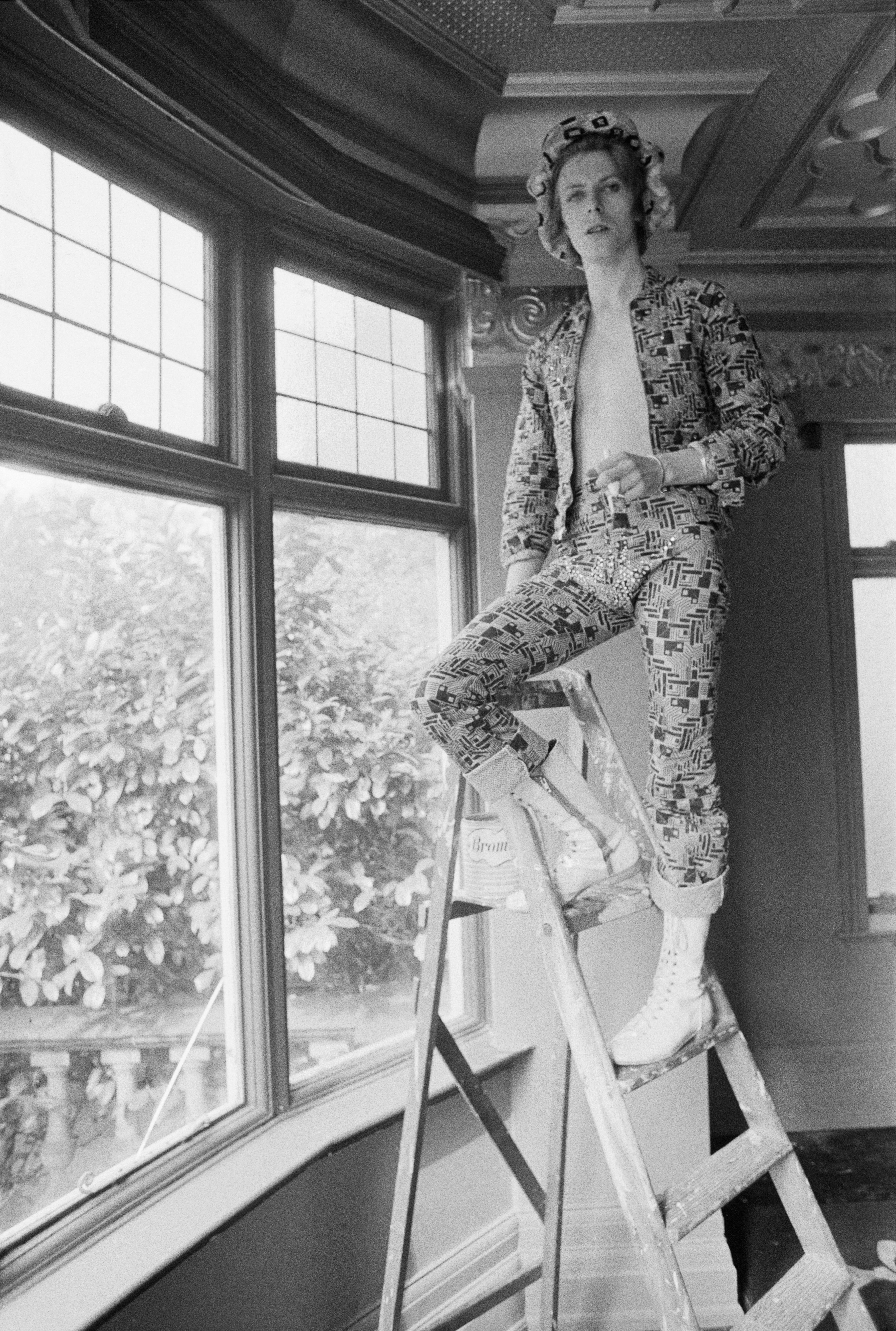 Bowie painting the ceiling of his commune at Haddon Hall, Beckenham, south-east London