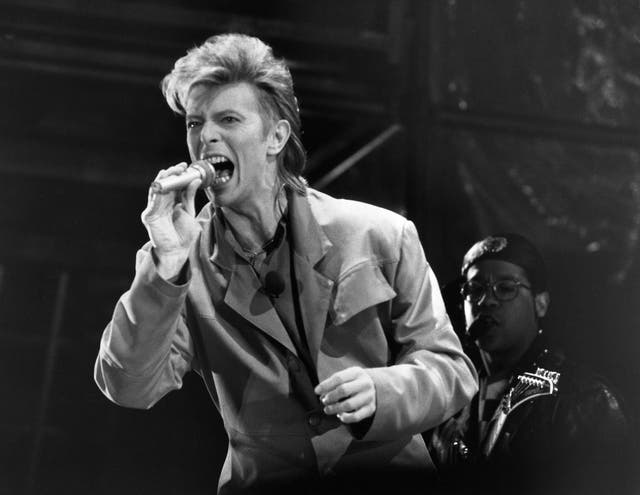 <p>Bowie in concert in front of the Reichstag building in West Berlin in June 1987</p>