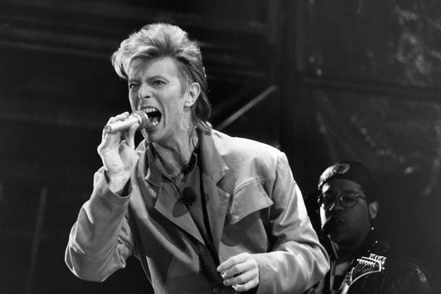 <p>Bowie in concert in front of the Reichstag building in West Berlin in June 1987</p>