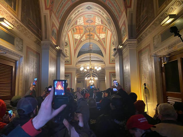 <p>Protesters swarm the US Capitol building before the Senate rejected an objection to Arizona’s electoral vote for Joe Biden.</p>