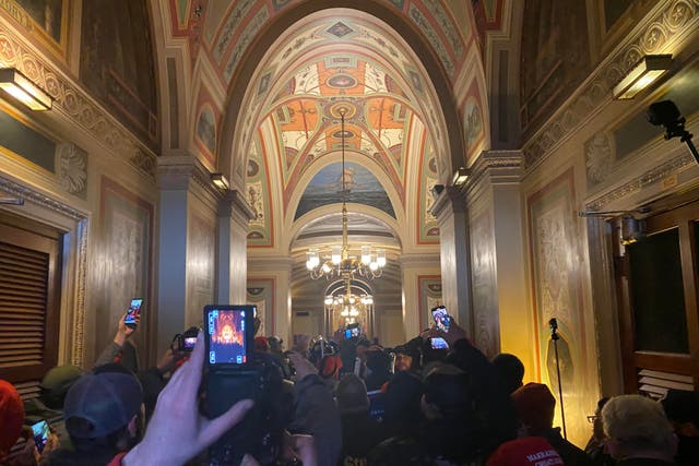 <p>Protesters swarm the US Capitol building before the Senate rejected an objection to Arizona’s electoral vote for Joe Biden.</p>