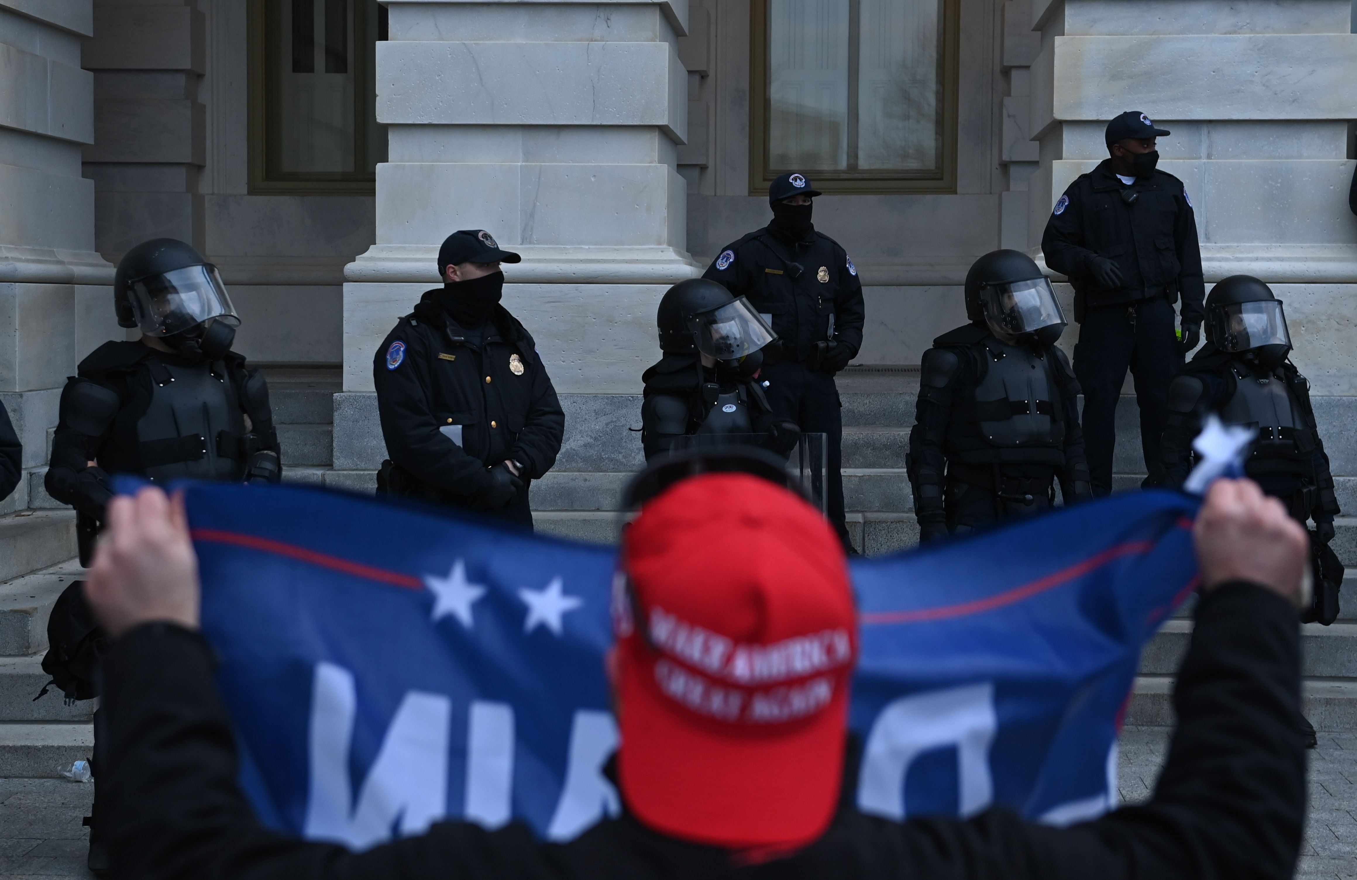 Trump supporters confront police and security forces at the US Capitol