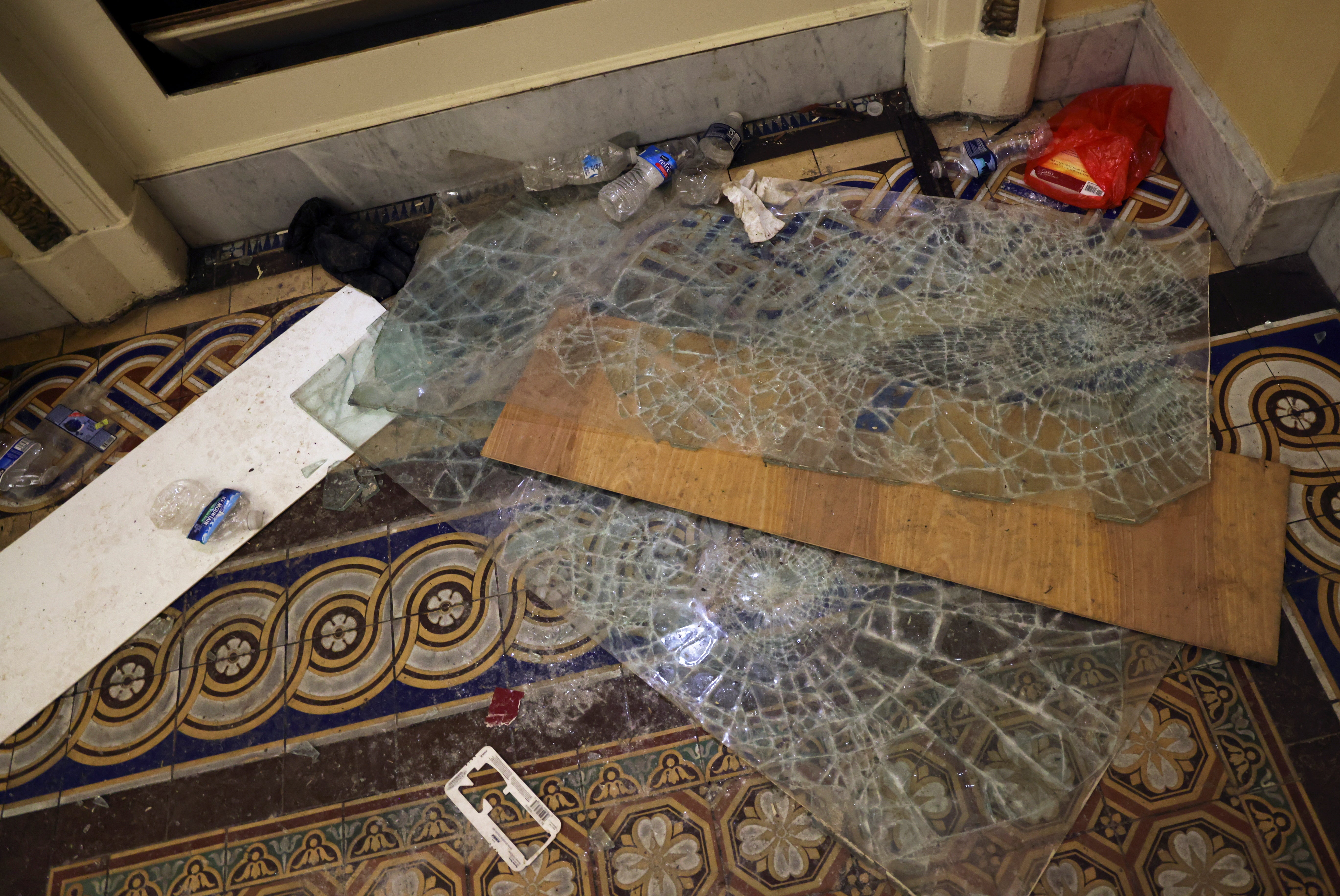 Shattered glass, broken furniture and flags scatter cross the floor were picture in the aftermath of the riots&nbsp;