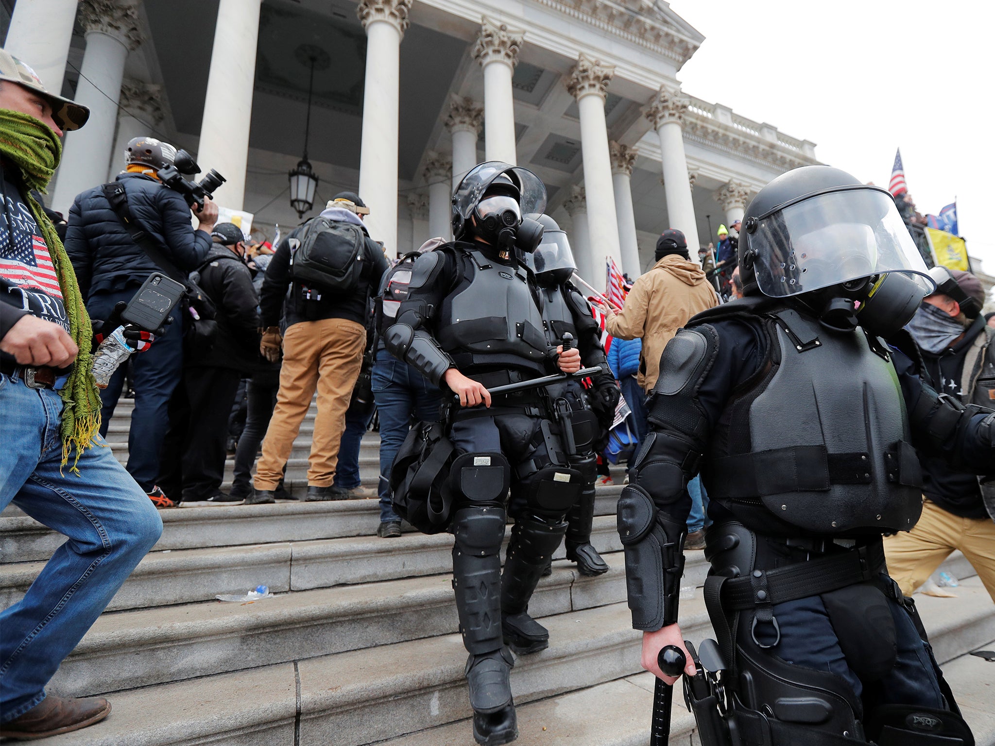 Shocking video shows mob dragging police officer down Capitol stairs