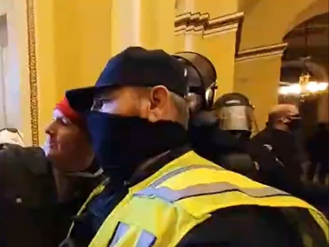 <p>Footage revealed a member of the United States Capitol Police posing for a selfie with a rioter</p>