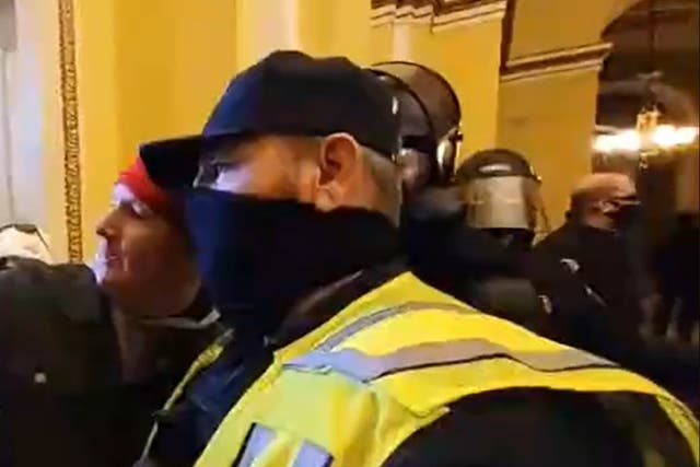 <p>Footage revealed a member of the United States Capitol Police posing for a selfie with a rioter</p>