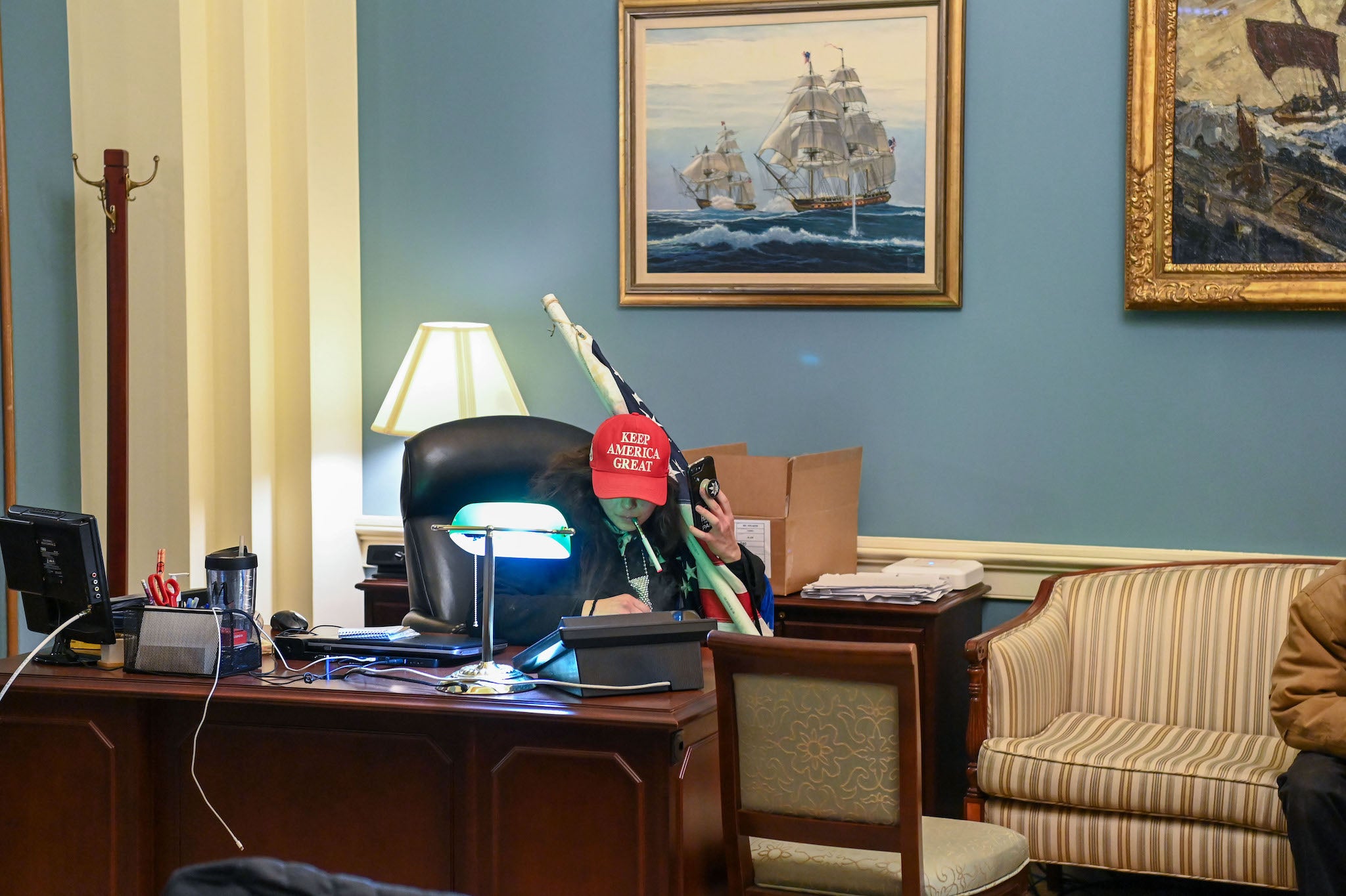 <p>A Trump supporter inside the office of Speaker of the House Nancy Pelosi</p>