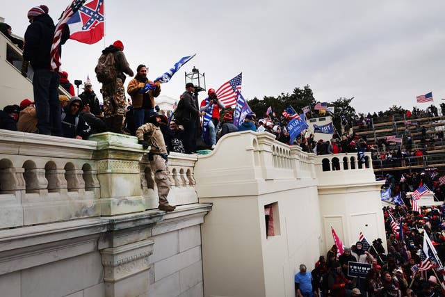 <p>Thousands of Donald Trump supporters storm the United States Capitol building following a "Stop the Steal" rally on 6 January, 2021 in Washington, DC</p>