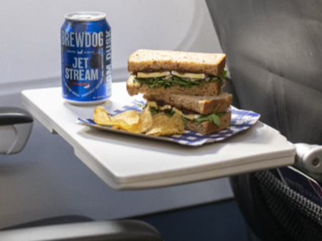 Flight bite: Tom Kerridge’s Brie and chutney sandwich, together with a specially brewed can of beer