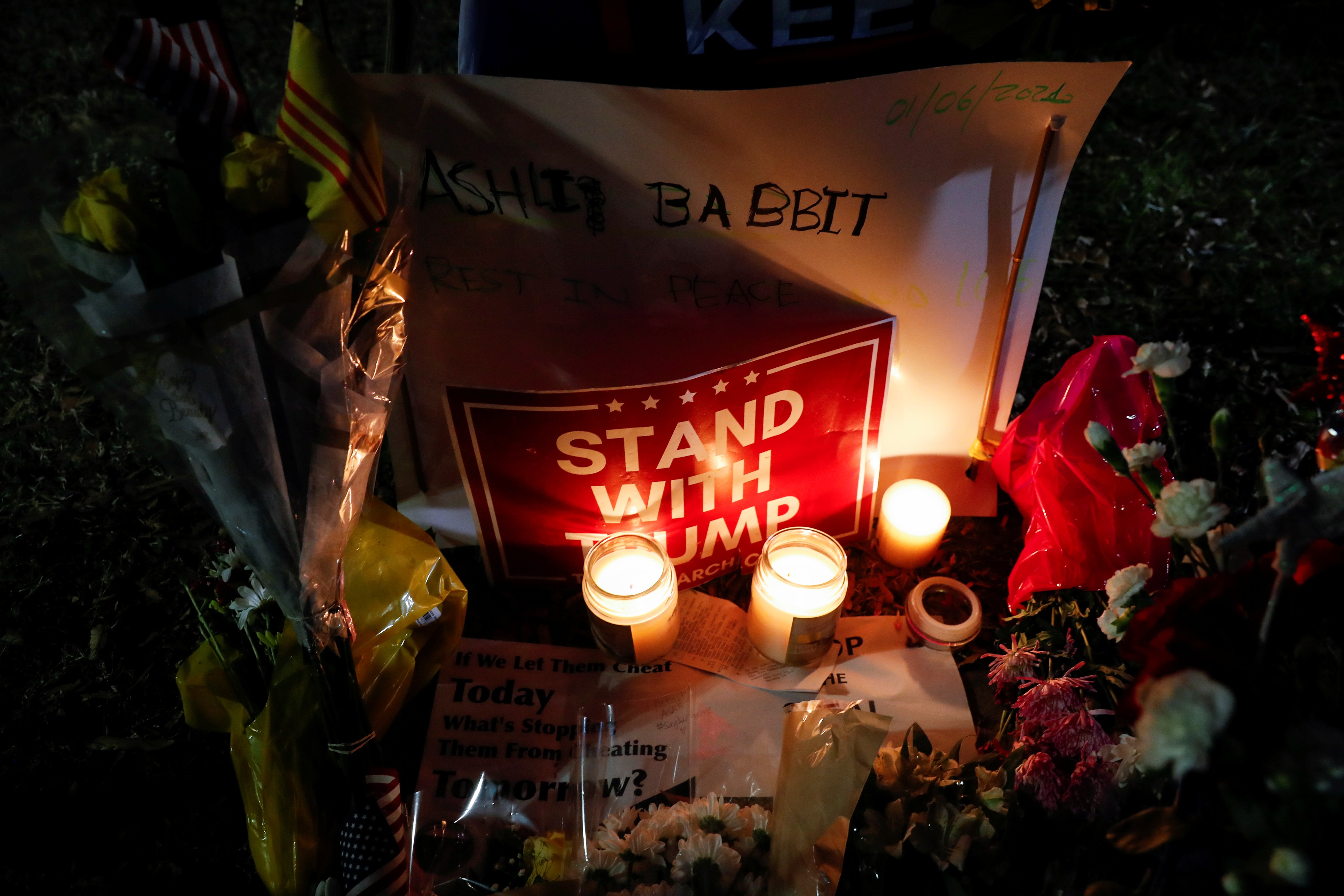 Flowers and candles are seen at a memorial for Ashli Babbitt, the woman who was shot dead at the U.S. Capitol after U.S. President Donald Trump's supporters stormed the building, in Washington, U.S. January 7, 2021.