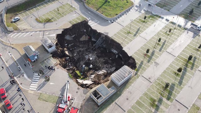 <p>A view of the large sinkhole that opened overnight in the parking of Ospedale del Mare hospital in Naples, Italy, Friday, Jan. 8, 2021.&nbsp;</p>