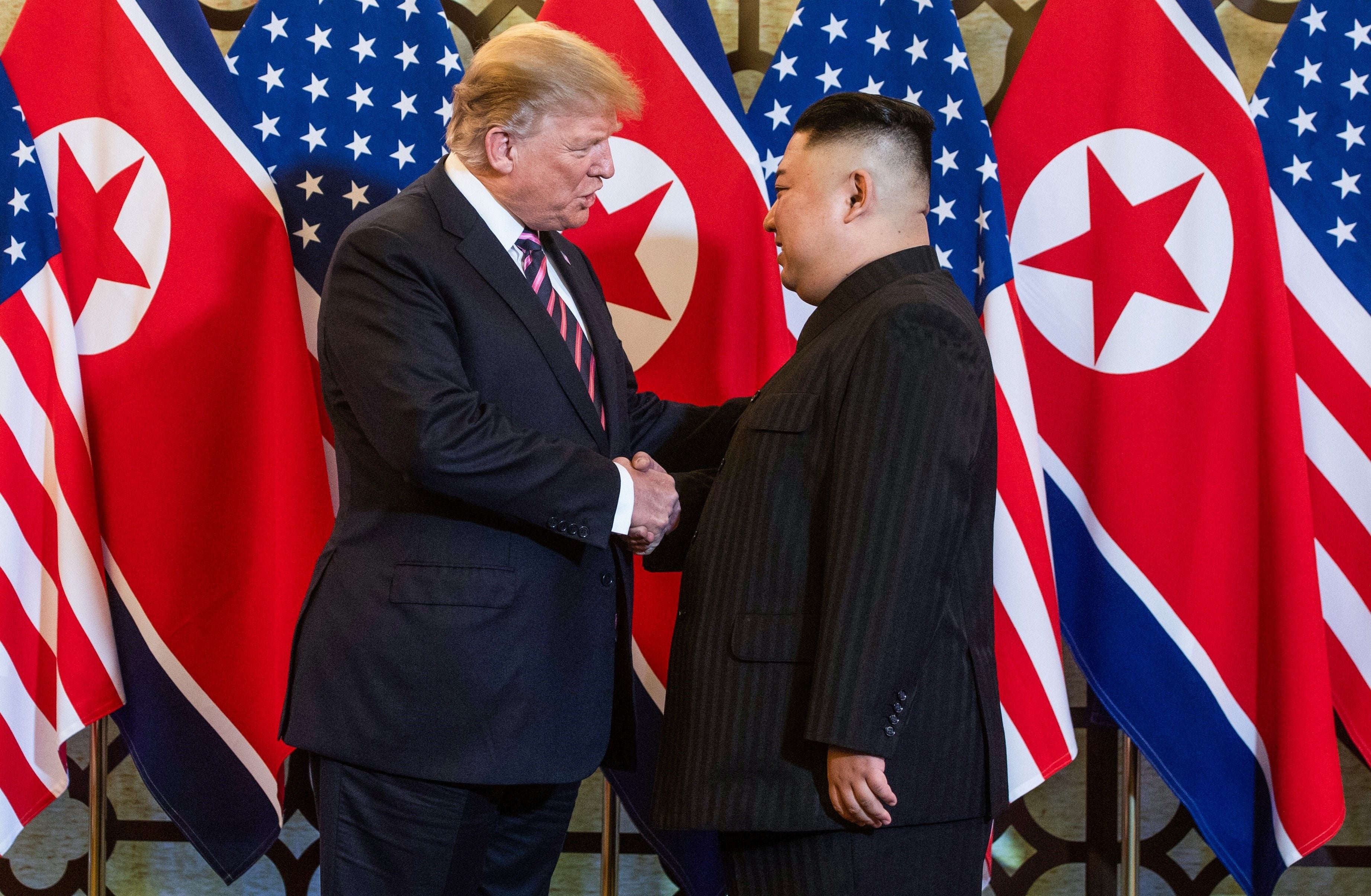 Donald Trump shaking hands with Kim Jong-un in Hanoi in February 2019