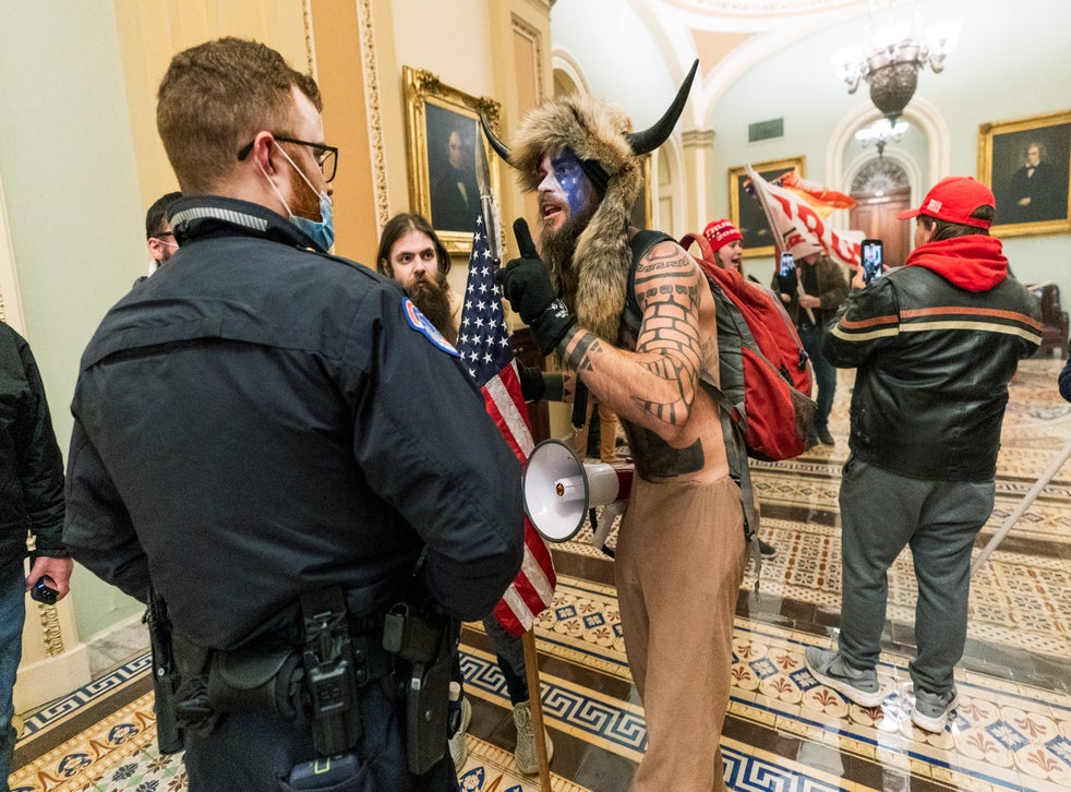 <p>Jake Angeli pictured in the Capitol</p>