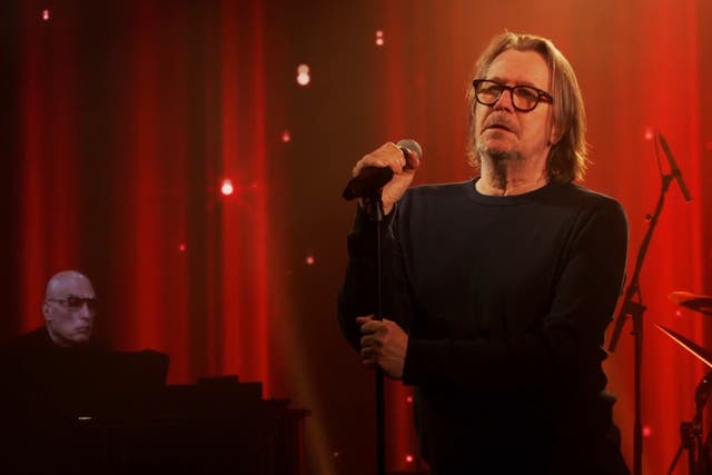 <p>Gary Oldman performing during A Bowie Celebration</p>