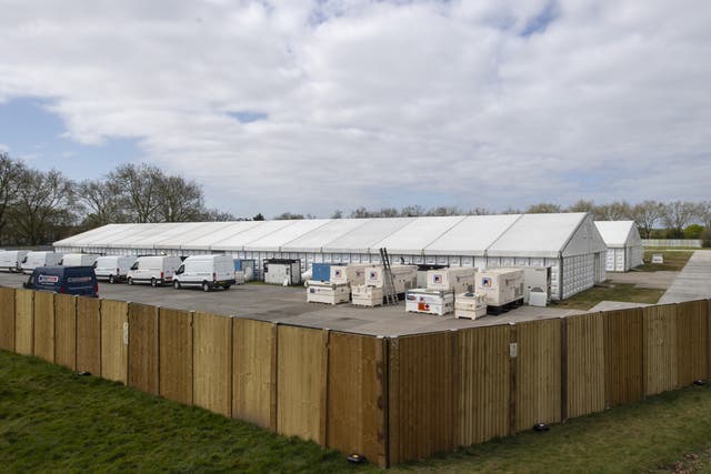 <p>Temporary mortuaries were first rolled out across the UK in areas like Wanstead Flats, London (pictured) to alleviate hospital morgues that had reached capacity</p>