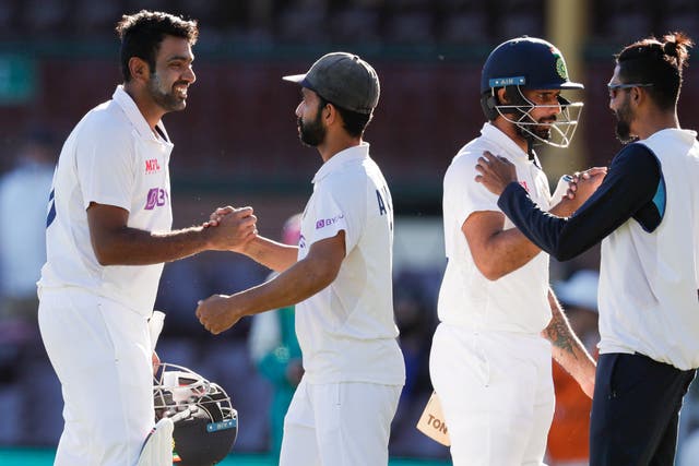 Indian players congratulate each other after securing a draw