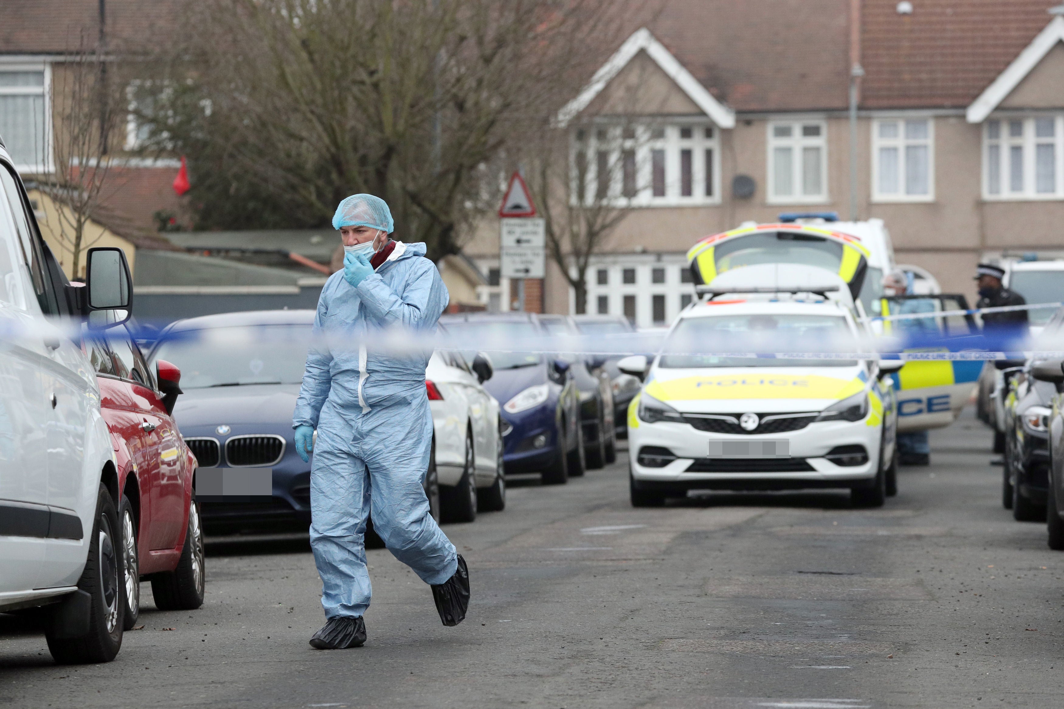 Forensic officers at the scene in Ilford, east London on Sunday