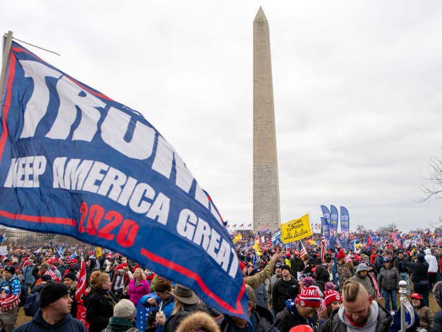 <p>People attend a rally in support of President Donald Trump to the backdrop of the Washington Monument.</p>