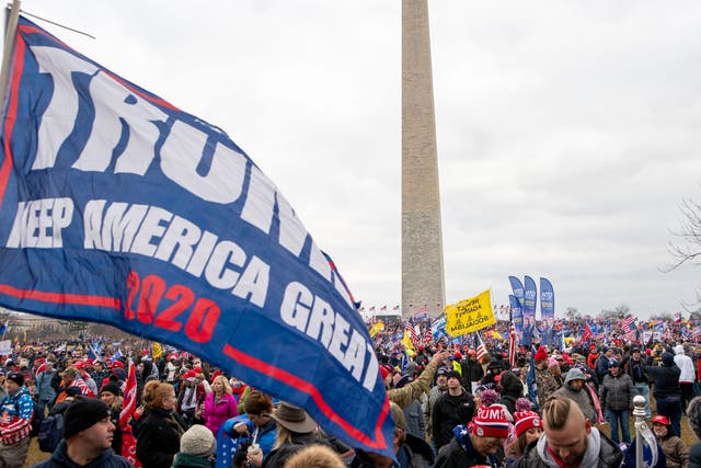 <p>People attend a rally in support of President Donald Trump to the backdrop of the Washington Monument.</p>