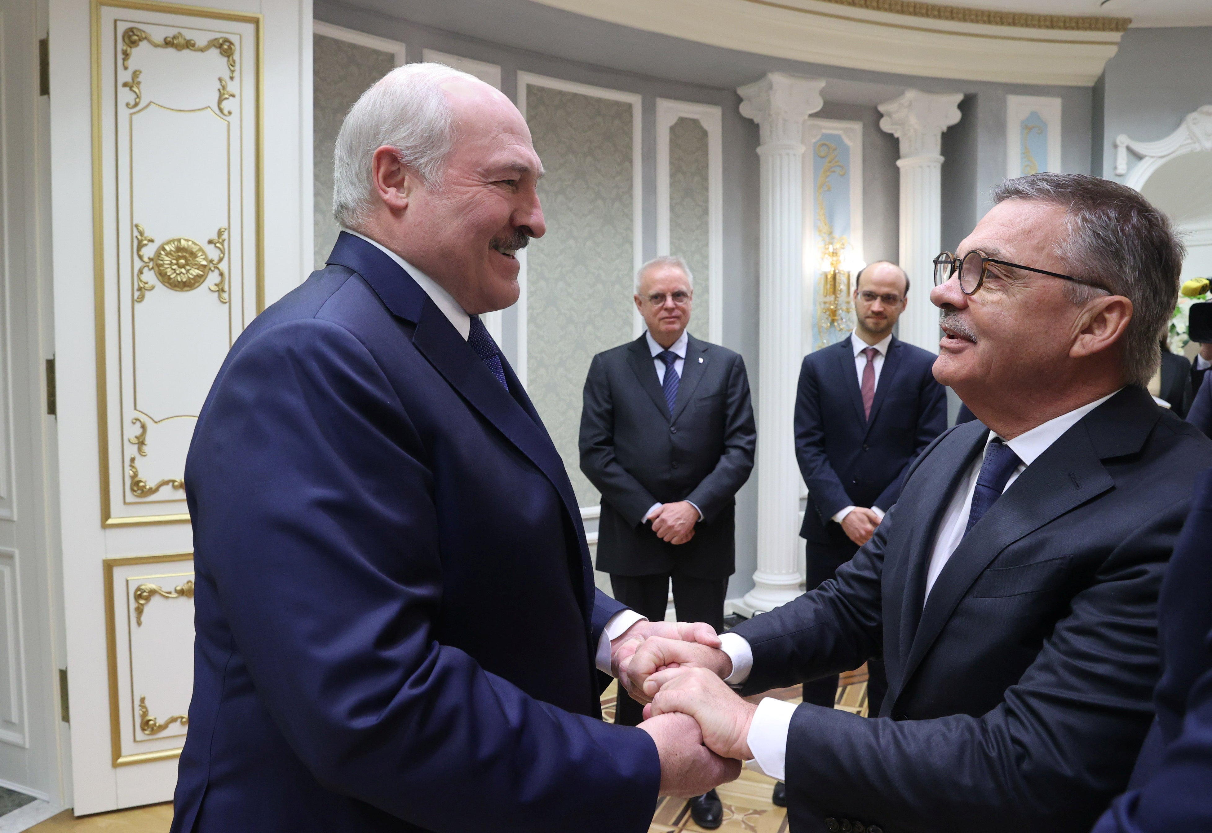 Hand in hand: Lukashenko, left, greets Fasel