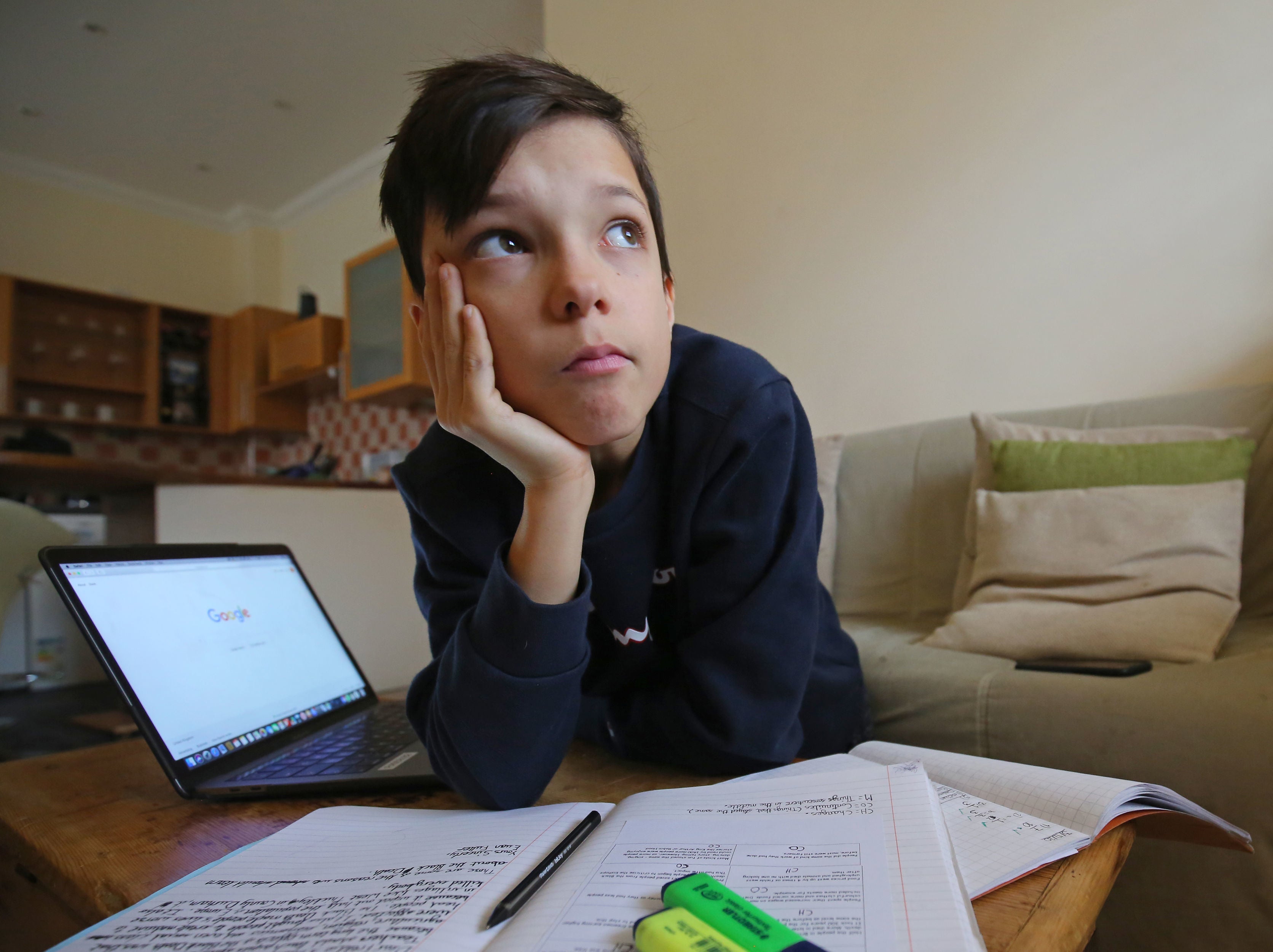 Secondary school pupil Euan Stanton studies at home during the lockdown