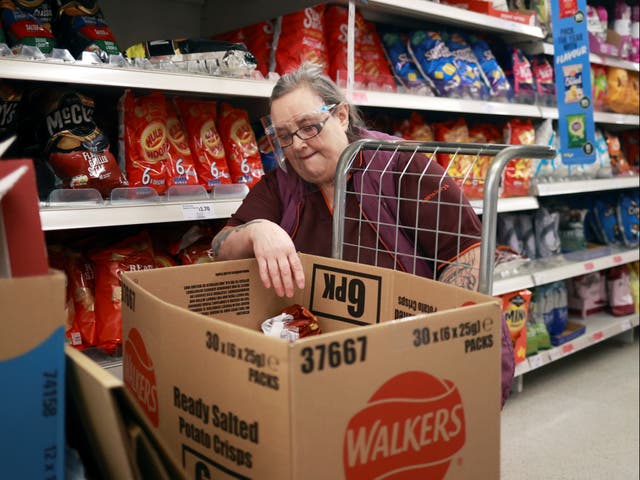 Member of staff at a Sainsbury’s in London during third lockdown