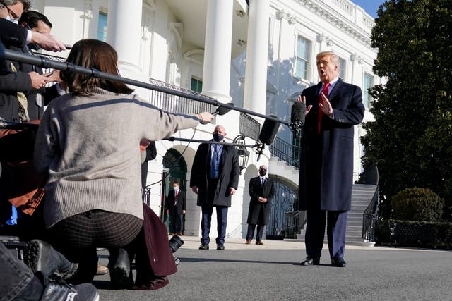 Donald Trump talks to the media before boarding Marine One on the South Lawn of the White House on 12 January 2021