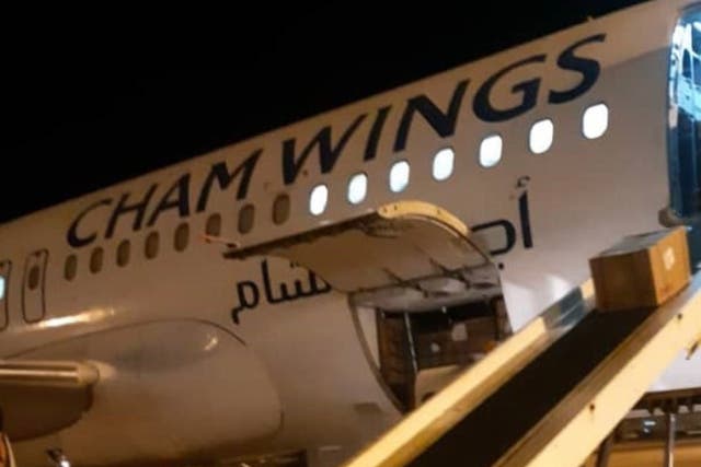 A Cham Wings plane delivering aid in Libya