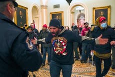 FBI: QAnon backer from Iowa was among 1st to breach Capitol