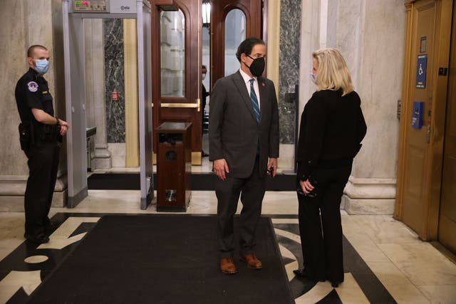 Lead impeachment manager Jamie Raskin, D-Md., speaks with House Republican Conference Chairwoman Liz Cheney, R-Wyo., who is supporting his effort to remove Donald Trump.